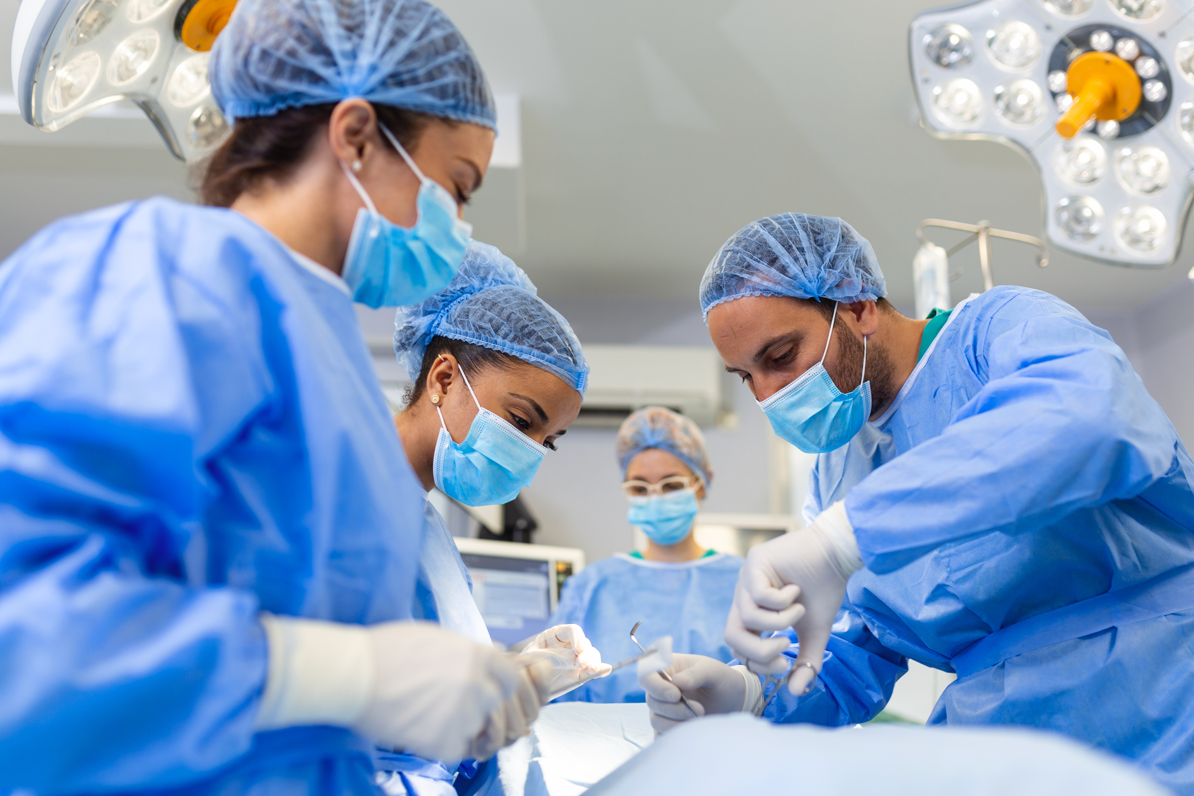 Doctor and assistant nurse operating for help patient from dangerous emergency case .Surgical instruments on the sterile table in the emergency operation room in the hospital.Health care and Medical